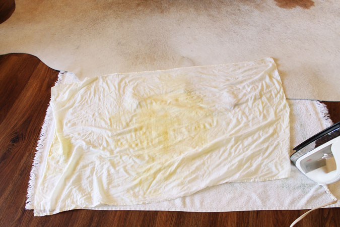 Remove wrinkles from cowhide rug