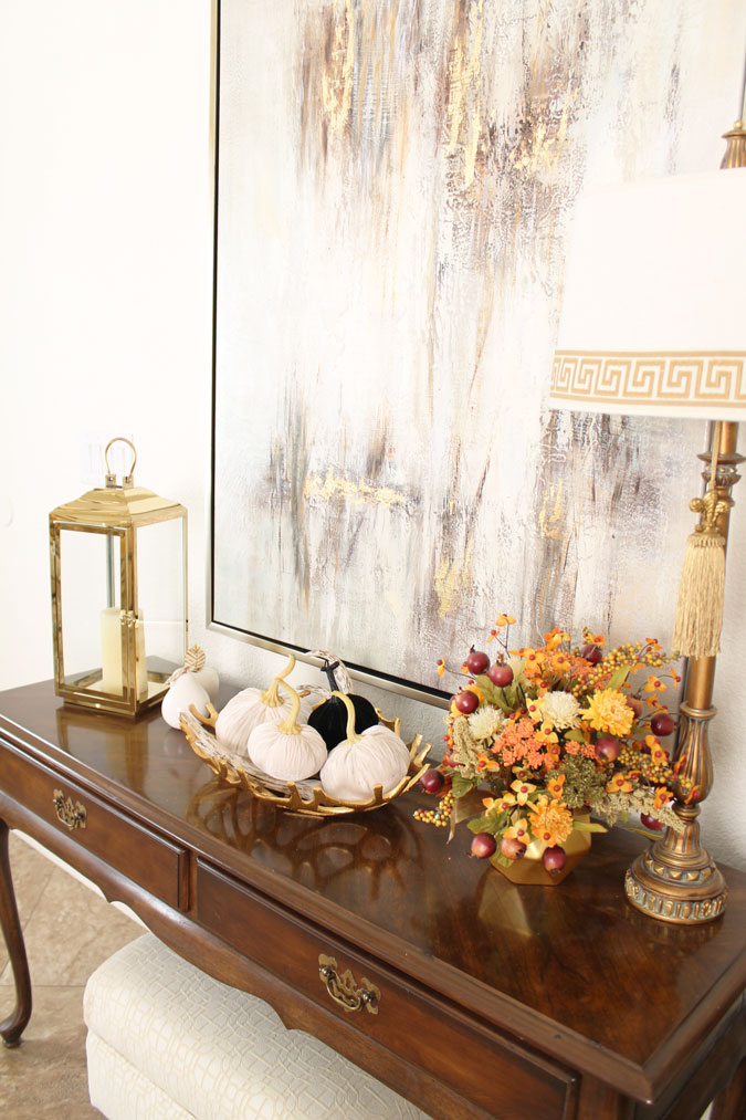 Velvet Pumpkins, a brass lantern and fall flowers in the entry